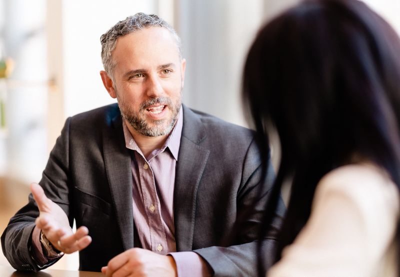 Derek Shebby coaching in a business conversation
